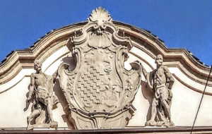 The coat of arms of the Litta family at the top of the façade